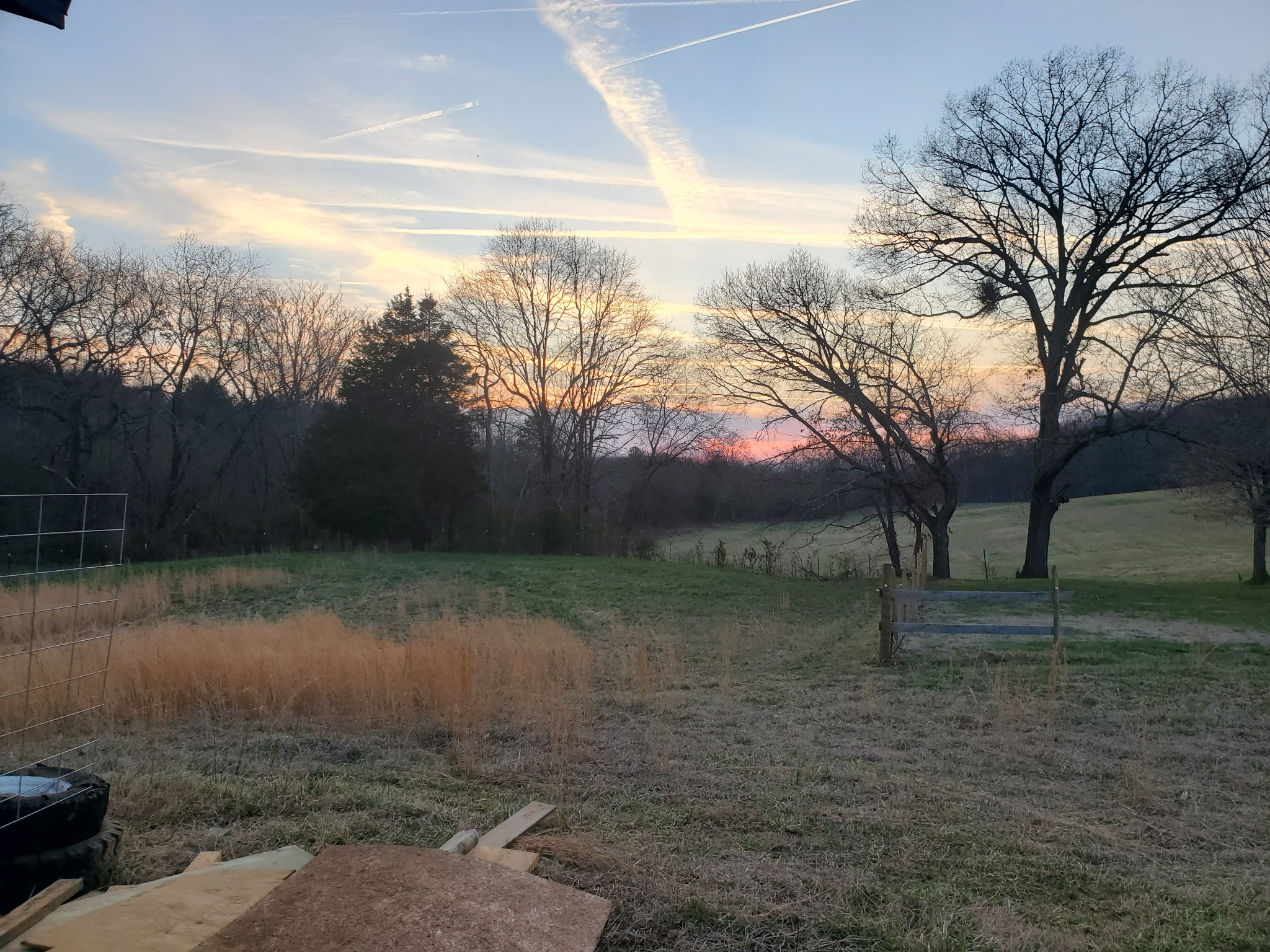 Sunset over the rolling pasture