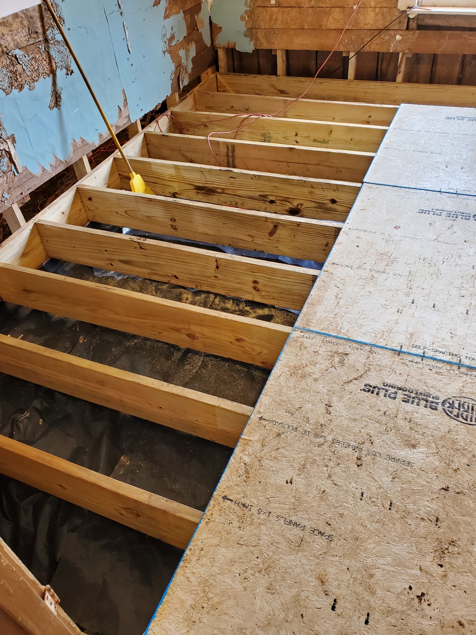 New floor joists and subfloor installation